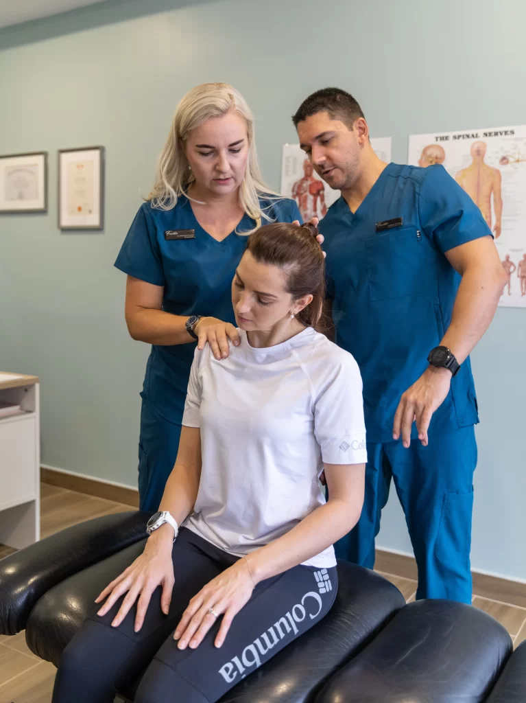 Chiropractor in Dubai performing spinal assessment at Franklin Chiropractic Clinic in JLT, providing expert hands-on treatment and personalised care.