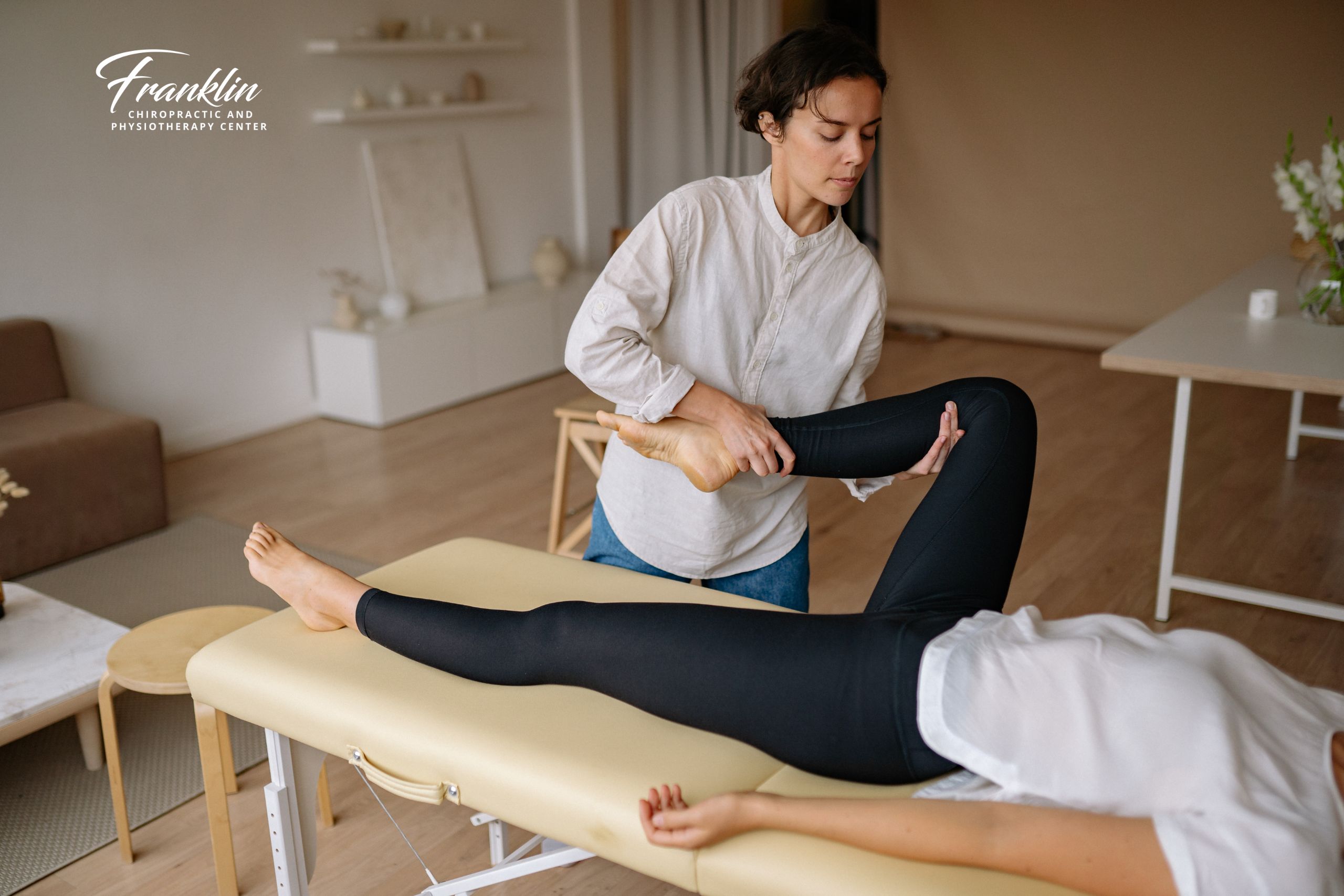 Physiotherapist guiding a hip and lower back stretch for sciatica relief